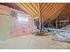 Spacious attic with exposed wood beams, plywood floor, and pink insulation at 2008 Surefire Ct, Denver, NC 28037