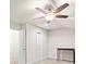 Bright bedroom featuring neutral carpet, ceiling fan, and two doors for versatile use at 2008 Surefire Ct, Denver, NC 28037