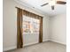 Light-filled bedroom with neutral walls, a ceiling fan, and a window with elegant curtains at 2008 Surefire Ct, Denver, NC 28037