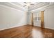Spacious bedroom boasts hardwood floors, white trim, ceiling fan, and a large window at 2008 Surefire Ct, Denver, NC 28037