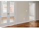 Bedroom with hardwood floors, white trim, and windows with shades for plenty of light at 2008 Surefire Ct, Denver, NC 28037