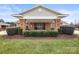 Charming brick building with covered entrance, manicured landscaping, and lush lawn at 2008 Surefire Ct, Denver, NC 28037