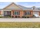 Charming brick home with well-manicured landscaping and inviting curb appeal at 2008 Surefire Ct, Denver, NC 28037