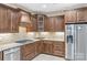 Well-lit kitchen features granite countertops, tiled backsplash, stainless steel appliances, and custom cabinetry at 2008 Surefire Ct, Denver, NC 28037