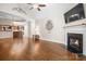 Open-concept living area with hardwood floors, fireplace, and ample space for entertaining at 2008 Surefire Ct, Denver, NC 28037