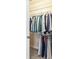 Walk-in closet with wire shelving, filled with hanging shirts, jackets, and other clothing items at 2008 Surefire Ct, Denver, NC 28037