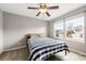 Bedroom with a ceiling fan, carpeted floors, and a large window at 205 Kendrick Meadow Ln, Mount Holly, NC 28120