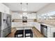 Modern kitchen featuring an island, granite countertops, and stainless steel appliances at 205 Kendrick Meadow Ln, Mount Holly, NC 28120