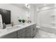 Modern bathroom with double vanity, white subway tile shower, and sleek fixtures at 2226 Revolution Park Dr, Charlotte, NC 28208