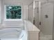 Bathroom with soaking tub and separate shower at 2507 Oakdale Creek Ln, Charlotte, NC 28216