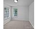 Well-lit bedroom with neutral walls and carpeting at 2507 Oakdale Creek Ln, Charlotte, NC 28216