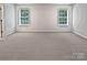 Spacious bedroom with neutral carpeting and large windows at 2507 Oakdale Creek Ln, Charlotte, NC 28216