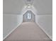 Spacious bonus room with window and neutral carpeting at 2507 Oakdale Creek Ln, Charlotte, NC 28216