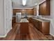 Kitchen with granite countertops, wood cabinets, and stainless steel appliances at 2507 Oakdale Creek Ln, Charlotte, NC 28216