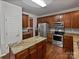 Spacious kitchen with island and wood cabinets at 2507 Oakdale Creek Ln, Charlotte, NC 28216