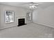 Living room with fireplace and neutral gray carpeting at 2507 Oakdale Creek Ln, Charlotte, NC 28216