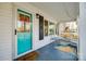 Inviting porch area with cozy seating and a bright colored front door at 30 Hunter St, York, SC 29745