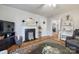 Charming living room with a decorative fireplace and classic furnishings at 30 Hunter St, York, SC 29745