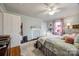 Comfortable bedroom showing a decorative fireplace, wood floors, and a doorway to another room at 30 Hunter St, York, SC 29745