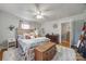 Spacious bedroom featuring a textured ceiling, hardwood floors, and calming natural light from the windows at 30 Hunter St, York, SC 29745