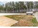 Large, fenced backyard with a shed and a small concrete patio area offers ample space for outdoor activities at 310 Black Rock School Rd, Cherryville, NC 28021