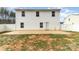 Spacious backyard with a patio area, partial grass, and a white fence for privacy at 310 Black Rock School Rd, Cherryville, NC 28021