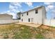 Expansive backyard featuring a patio, partial grass, and a white privacy fence at 310 Black Rock School Rd, Cherryville, NC 28021