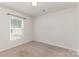 Bright bedroom with neutral carpet and natural light from the window at 310 Black Rock School Rd, Cherryville, NC 28021