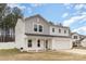 Charming two-story home with a covered porch, attached two car garage, and fenced-in yard at 310 Black Rock School Rd, Cherryville, NC 28021