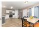 Eat-in kitchen features stainless steel appliances and a connected dining area at 310 Black Rock School Rd, Cherryville, NC 28021