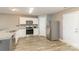 Bright kitchen featuring stainless steel appliances and wood-look flooring at 310 Black Rock School Rd, Cherryville, NC 28021