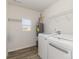 Functional laundry room equipped with modern appliances, shelving, and a window for natural light at 310 Black Rock School Rd, Cherryville, NC 28021