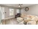 Cozy living room featuring neutral colors, a ceiling fan, and comfortable seating at 310 Black Rock School Rd, Cherryville, NC 28021