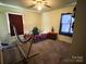 A warm bedroom featuring a hammock and cozy bed with natural light creating a comfortable, relaxing atmosphere at 3520 Carlyle Dr, Charlotte, NC 28208