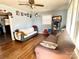 Inviting living room with hardwood floors, light blue walls, and natural light, creating a cozy and airy space at 3520 Carlyle Dr, Charlotte, NC 28208