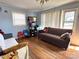 Sunlit living room featuring gleaming hardwood floors and comfortable seating, perfect for relaxation and entertaining at 3520 Carlyle Dr, Charlotte, NC 28208