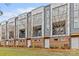 Contemporary townhome exterior with brick accents, balconies, and landscaped front yards at 3617 Vallette Ct, Charlotte, NC 28203