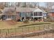 Expansive backyard featuring a patio, well-maintained lawn, and mature landscaping at 390 N Oakwood Dr, Statesville, NC 28677