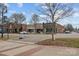 Quaint street view with brick sidewalks, mature trees, and charming storefronts at 390 N Oakwood Dr, Statesville, NC 28677