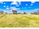 View of a large, grassy backyard, bordered by trees and other houses at 425 Webb Rd, Shelby, NC 28152