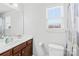 Clean bathroom with a single sink vanity, toilet, mirror, and window, perfect for guests or everyday use at 425 Webb Rd, Shelby, NC 28152