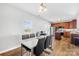 Open concept dining room with modern white table, seating for six, and a view of the kitchen area at 425 Webb Rd, Shelby, NC 28152