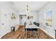Bright dining room featuring a modern white table, seating for six, and a window letting in natural light at 425 Webb Rd, Shelby, NC 28152