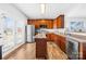 Well-lit kitchen with stainless steel appliances, wood cabinets, an island, and access to backyard at 425 Webb Rd, Shelby, NC 28152