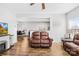 Living room featuring hardwood floors and a fireplace, with open access to dining area at 425 Webb Rd, Shelby, NC 28152