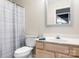 Functional bathroom featuring a bathtub, toilet and sink at 449 Doves Crest Ct, Stanley, NC 28164