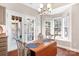 Kitchen with stainless steel appliances, eat-in table, bay window, and door to back deck at 449 Doves Crest Ct, Stanley, NC 28164