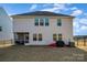 Spacious backyard featuring a screened porch area, perfect for entertaining guests outdoors at 452 Kennerly Center Dr, Mooresville, NC 28115