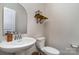 Elegant powder room featuring a pedestal sink and modern fixtures at 452 Kennerly Center Dr, Mooresville, NC 28115