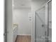 Bright bathroom featuring granite-topped vanity and glass shower at 508 Hawley St, Charlotte, NC 28214